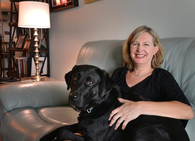 Lea Gaffen of Melbourne Beach is pictured with her seeing-eye dog, Marston. Gaffen, who is slowly losing her vision to retinitis pigmentosa (RP), runs a regular virtual support group for others with vision loss.