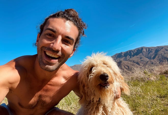 Actor-producer Justin Baldoni takes a selfie with his 4-year-old Golden Doodle Happy.