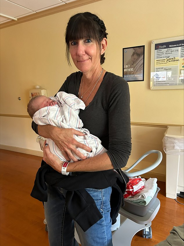 Tina Willits, now 53 years old and from Florida, was given just 24 months to live after she was diagnosed with stage four breast cancer. But the mother-of-five is still here 31 months on and cancer-free. She is pictured above holding one of her grandchildren