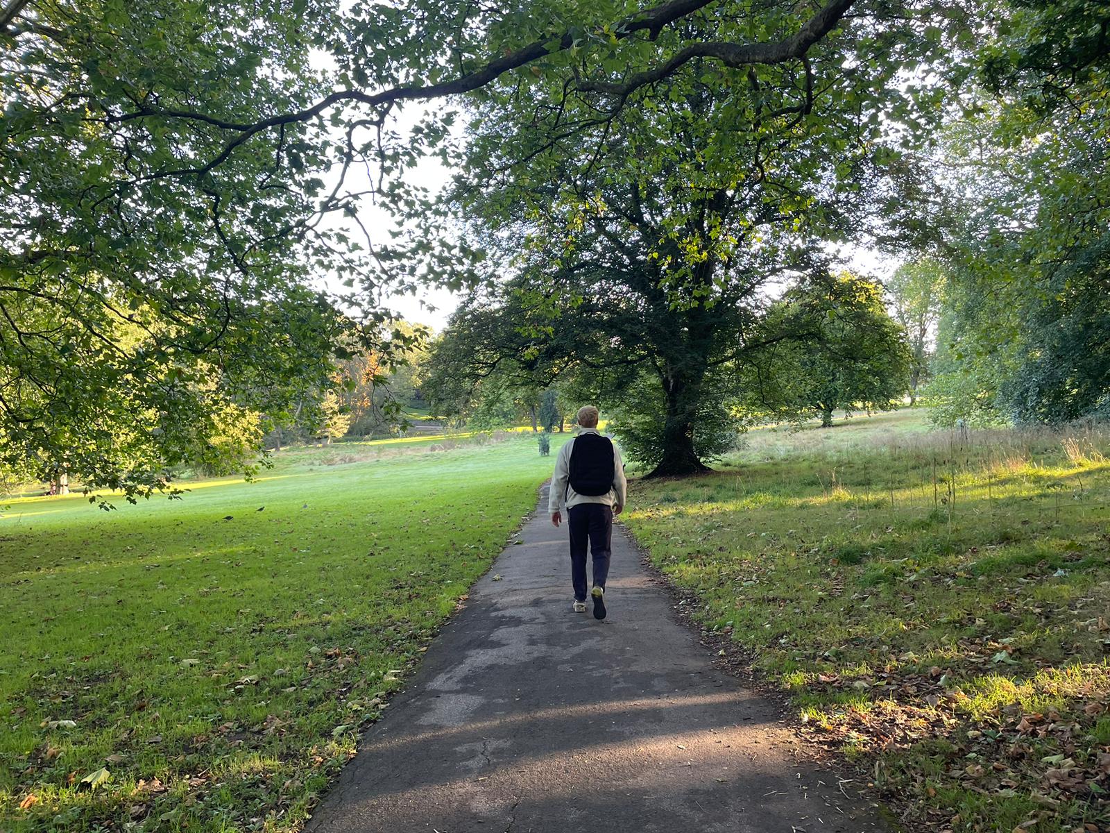 Fitness writer Harry Bullmore rucking in a park