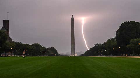 TOPSHOT - A lightning strike is seen during a storm, with the Washington monument in the foreground in Washington, DC on August 29, 2024. (Photo by ANDREW CABALLERO-REYNOLDS / AFP) (Photo by ANDREW CABALLERO-REYNOLDS/AFP via Getty Images)