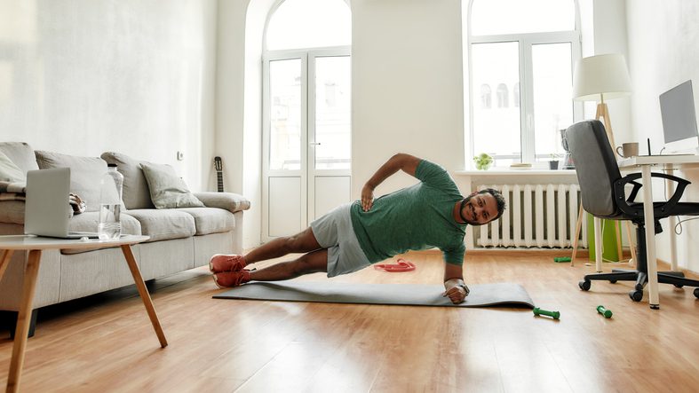 man doing side plank