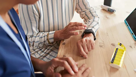 Getty Images Some smartwatches can identify the early signs of Parkinson's disease up to seven years before it is diagnosed (Credit: Getty Images)