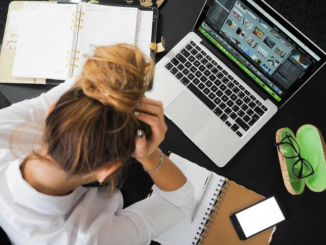 woman stressed out at a laptop