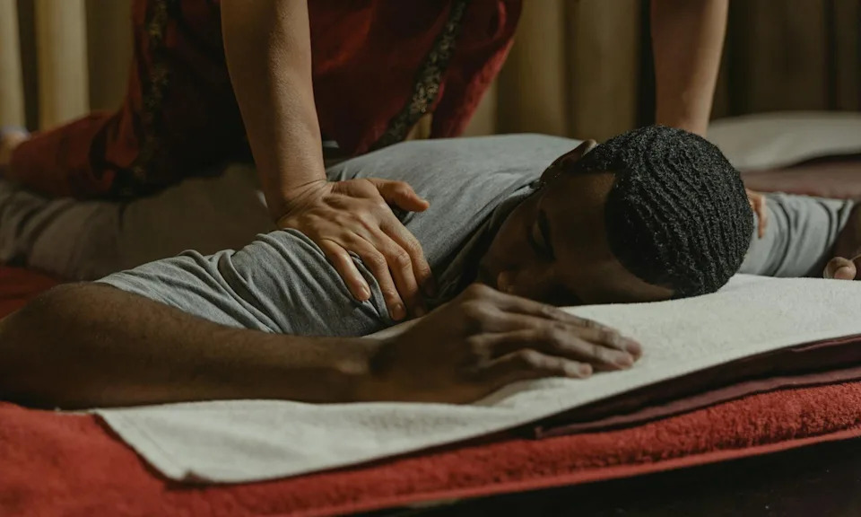 man getting massage wellness retreat