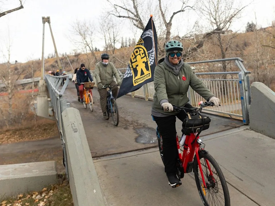  Cyclists cross Memorial Drive for the sixth annual Veterans Transition Network’s Ride for Veteran Mental Health in Calgary on Sunday, Nov. 9, 2025. The ride was organized by U.S. Army veteran Tegh Singh after his own struggles following tours in Iraq and Afghanistan.