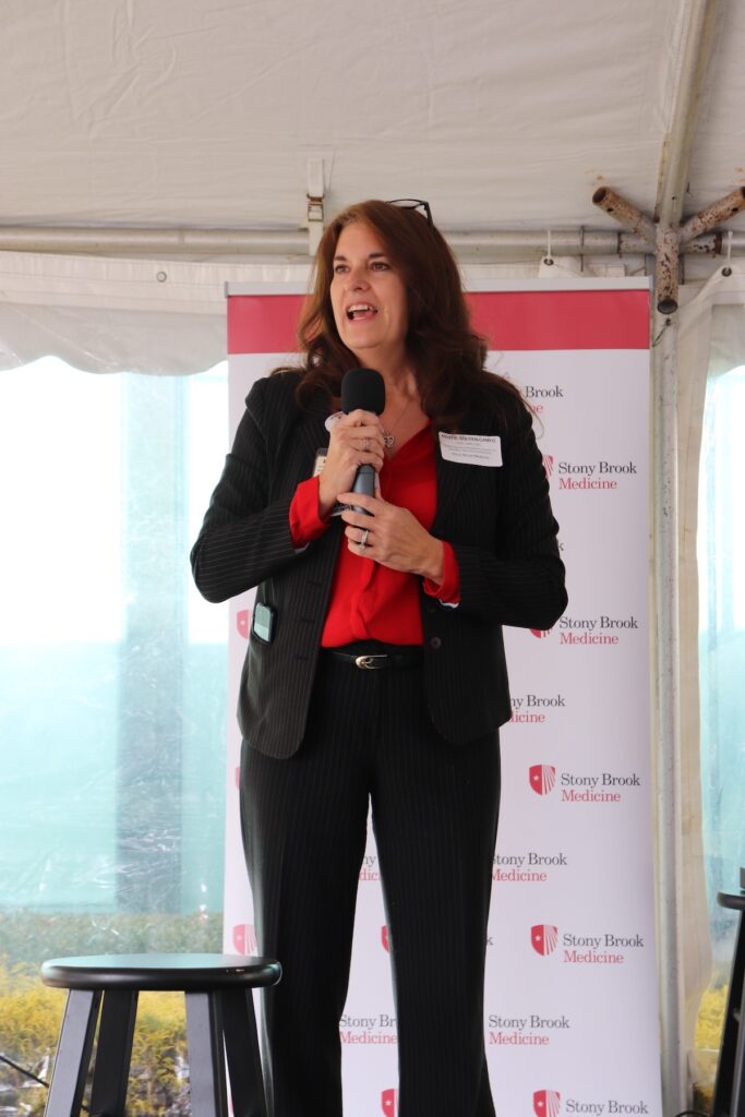 Assistant vice president of neurosciences and psychiatry Dr. Kristie Golden Campo speaks to the crowd of 30 people about how proud she is of the hospital’s efforts. (Nicole Wagner photo)