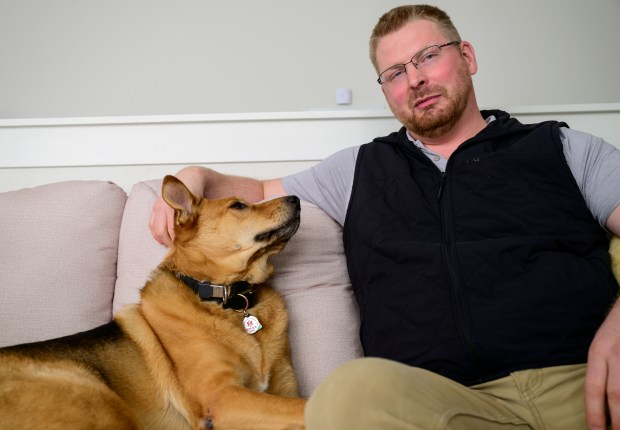 Mounds View veteran Tanner Wilde with his service dog Taz.