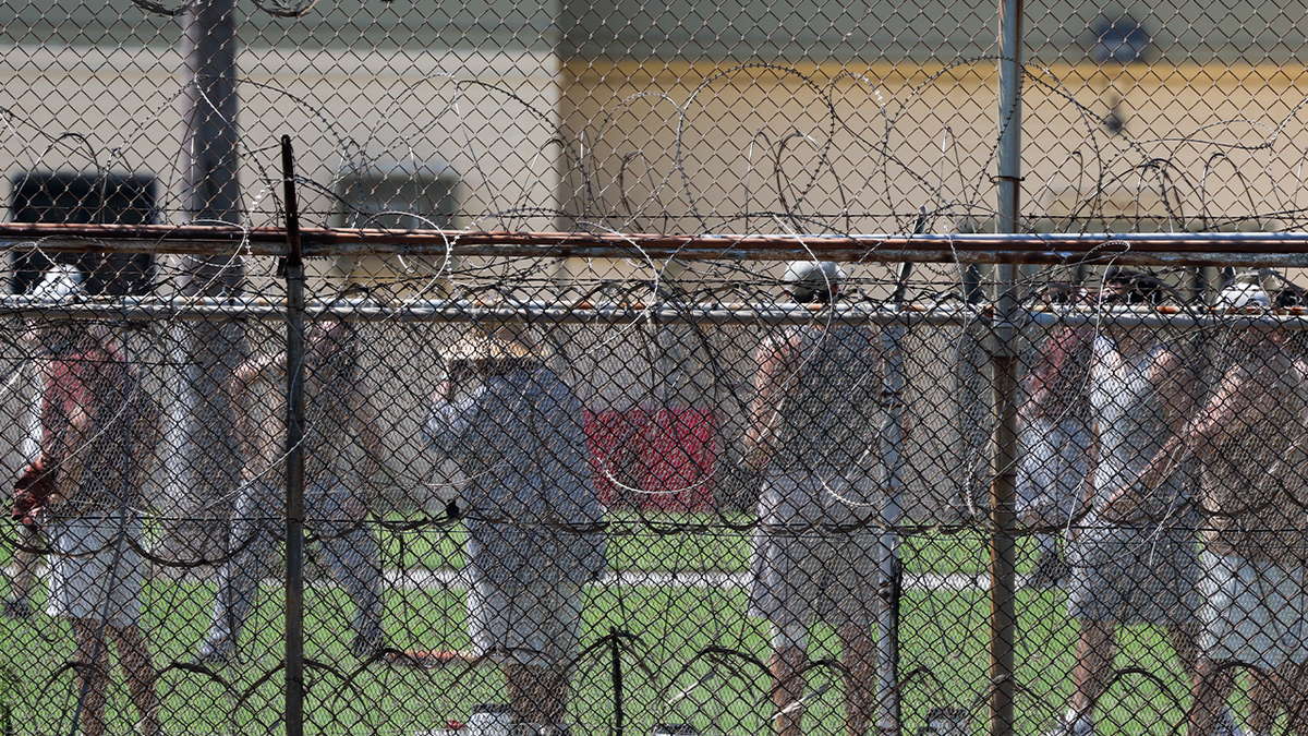 Federal inmates gather in prison yard