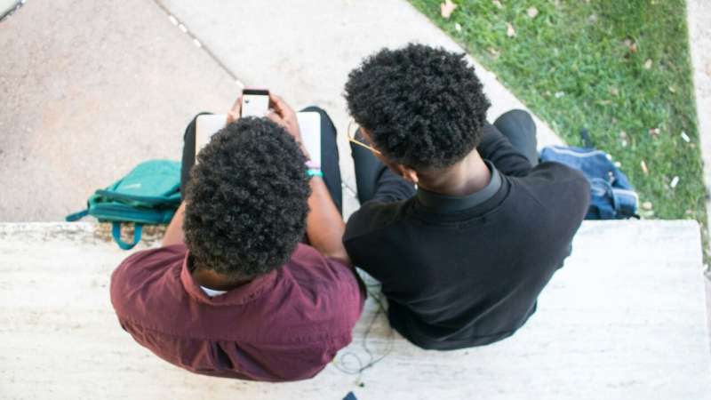 students looking at phones