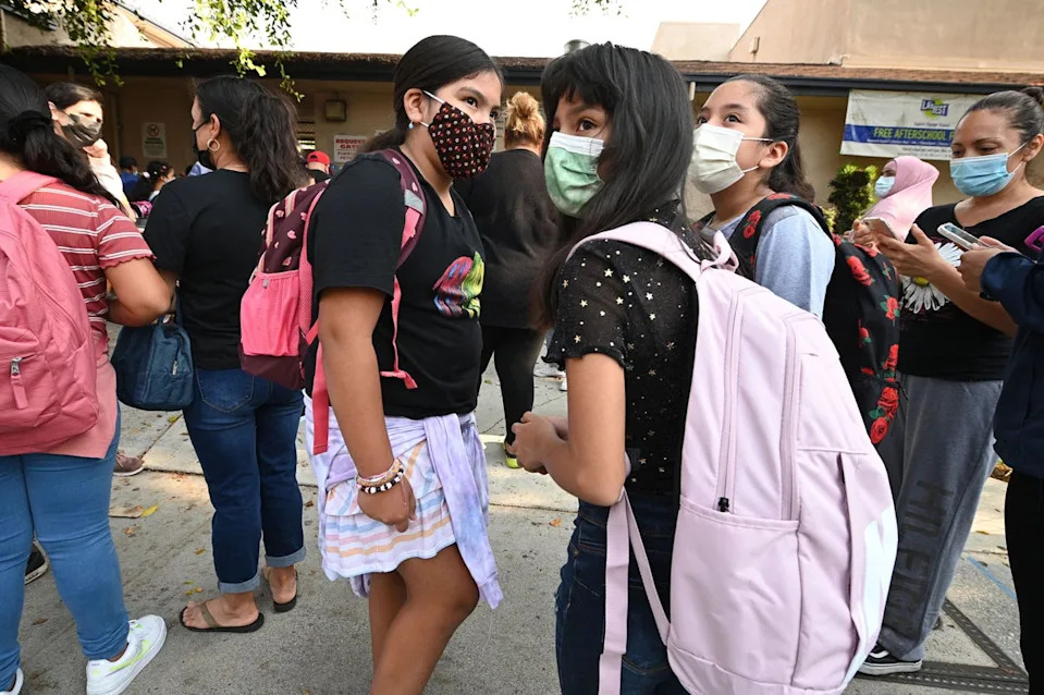Students and parents arrive masked for the first day of the school year at Grant Elementary School in Los Angeles, California, in August 2021. After schools reopened amid the Covid pandemic, the likelihood a child would be diagnosed with a mental health condition fell 43 percent within just nine months (AFP via Getty Images)