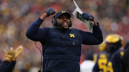 Sherrone Moore's contract with Michigan was terminated due to an inappropriate relationship with a staff member.(Getty Images via AFP)