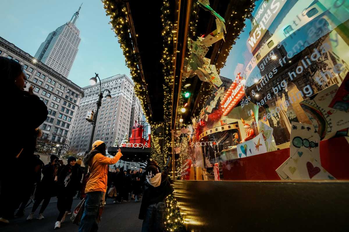 macy's herald square store exterior people taking photos of window displays