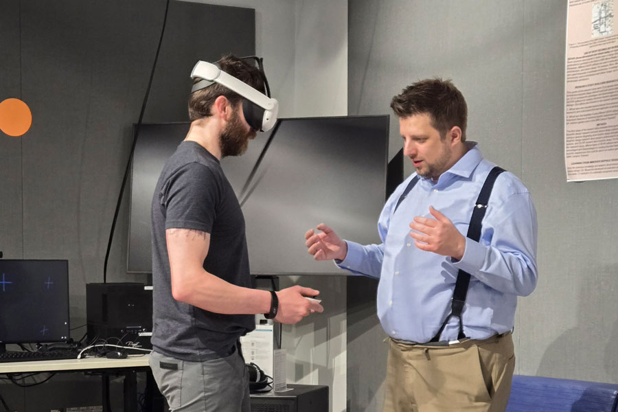 an instructor shows a student virtual reality tools