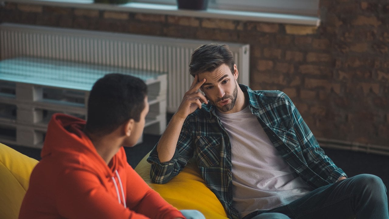 Two young men having a conversation.