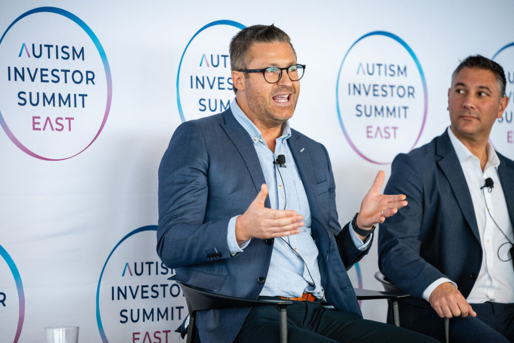 Michael Quinn speaking at INVEST 2025