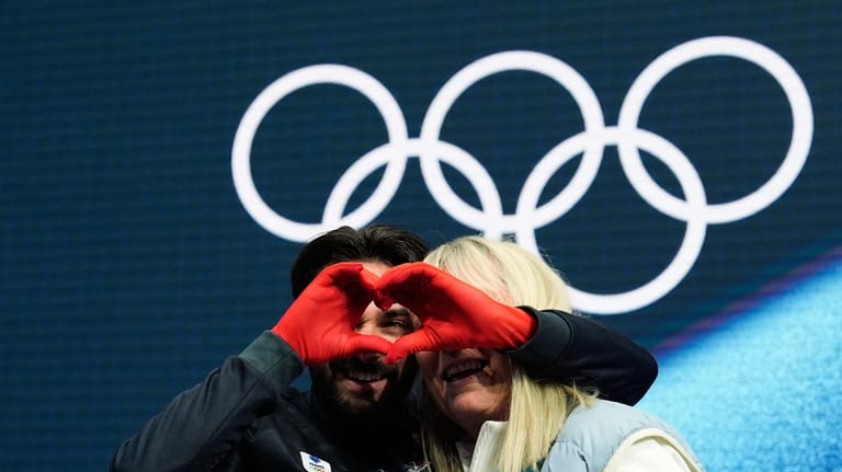 Kevin Aymoz of France reacts to his scores after competing...