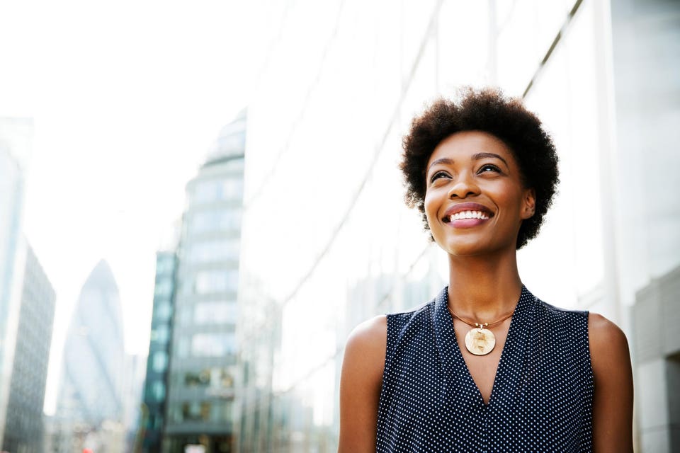 Woman looking next to buildings
