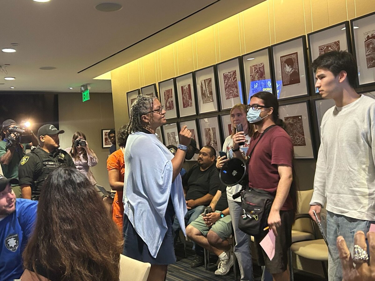 Shouting match erupts at city council meeting over police shooting death