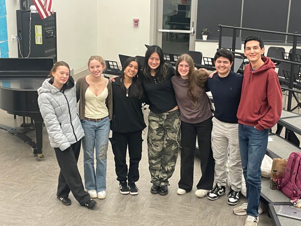 Concord-Carlisle High School’s a cappella group Take Notes will perform at EmerSong. Left to right are Joanna Steanz, Paloma Wigton, Celeste Pinto, Marilyn Teng, Tessa Houston-Fuller, James Feinberg, and Charles Mastromarino. Courtesy photo
