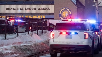 Police stand outside the perimeter they created around the Dennis M. Lynch Arena where a shooting occurred earlier today in Pawtucket, Rhode Island, on February 16, 2026. (Photo by Joseph Prezioso / AFP) (AFP)