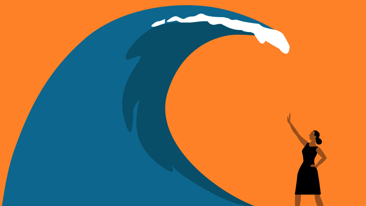 Strong woman withstanding a tsunami wave as a metaphor for everyday stress and life challenges.