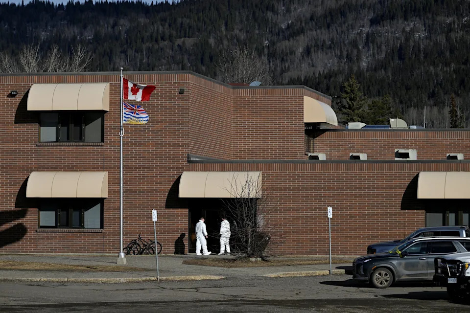 Forensic specialists get into the high school where a deadly mass shooting took place, in the town of Tumbler Ridge, British Columbia, Canada February 11, 2026. REUTERS/Jennifer Gauthier