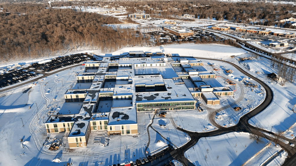 aerial view of a building complex on snow-covered ground