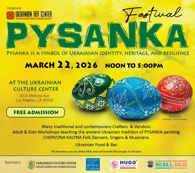 A yellow poster with decorated eggs on it that reads "Pysanka" in large green letters. 