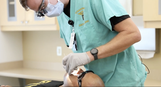 Link to Video: A dentist working in a patient's mouth