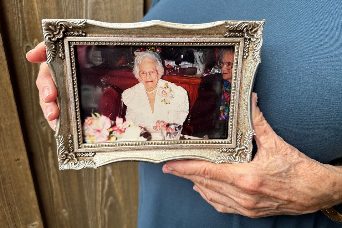 Martha Stem holds an image of her grandmother. Her grandmother appeared to Stem during her second psilocybin journey, which centered on moving forward in life.