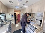 Elda Medina, advanced medical assistant at La Clinica, takes notes in the new mobile health center.