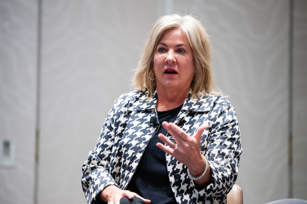 Kerri Garrison speaking at INVEST 2025