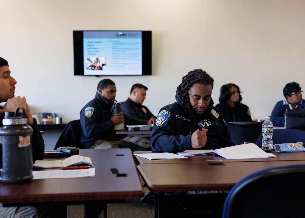 Baltimore Police officers, dispatchers, and other first responders attend a mental health awareness training with NAMI (National Alliance on Mental Illness) at the E&T Academy at the University of Baltimore.
