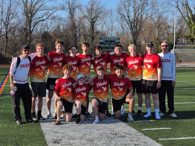Members of the U.S.'s 17th best Ultimate Frisbee team are, kneeling from left, Benny Schwam, Hudson Ruger, A.J. Daniel, Ryan Lee; and standing, head coach Simon Feeman, Daniel Prange, Misha Swann, Ben Raynor, Max Fischer, Ian Taylor, Adam Jones, Dylan Shindler, Max Cronholm and assistant coach Jake Doss. (COURTESY OF RY TAYLOR)