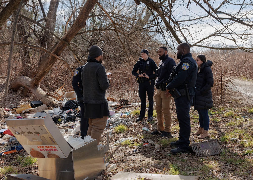 The Baltimore Police Crisis Response Team speaks to an unhoused individual who made a call for help.