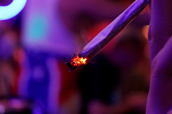 Moody photo of a person smoking cannabis