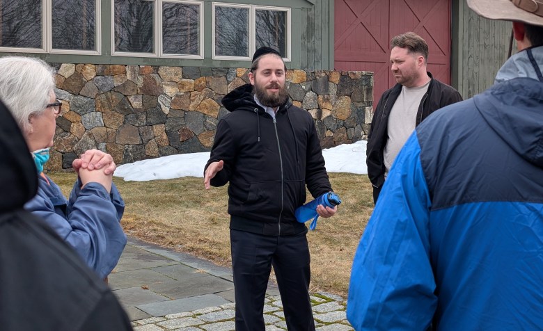 Chaim Berger, CEO of Bold Steps, speaks to Peterborough residents in front of the main building on 468 Greenfield Road. 