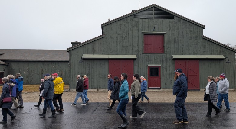 Residents walk around Bold Steps Behavioral Health's proposed treatment clinic building. 