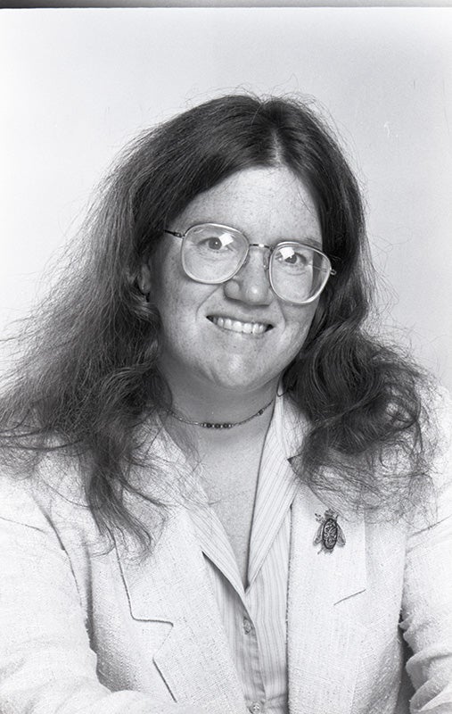 Headshot of Allerton smiling.