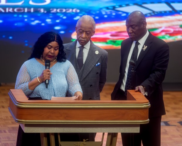 Audrey Jones, Steven Jones' sister, stands with attorney Ben Crump and Rev. Al Sharpton as she speaks during services at The First Cathedral in Bloomfield on Thursday, March 26, 2026. (Aaron Flaum/Hartford Courant)