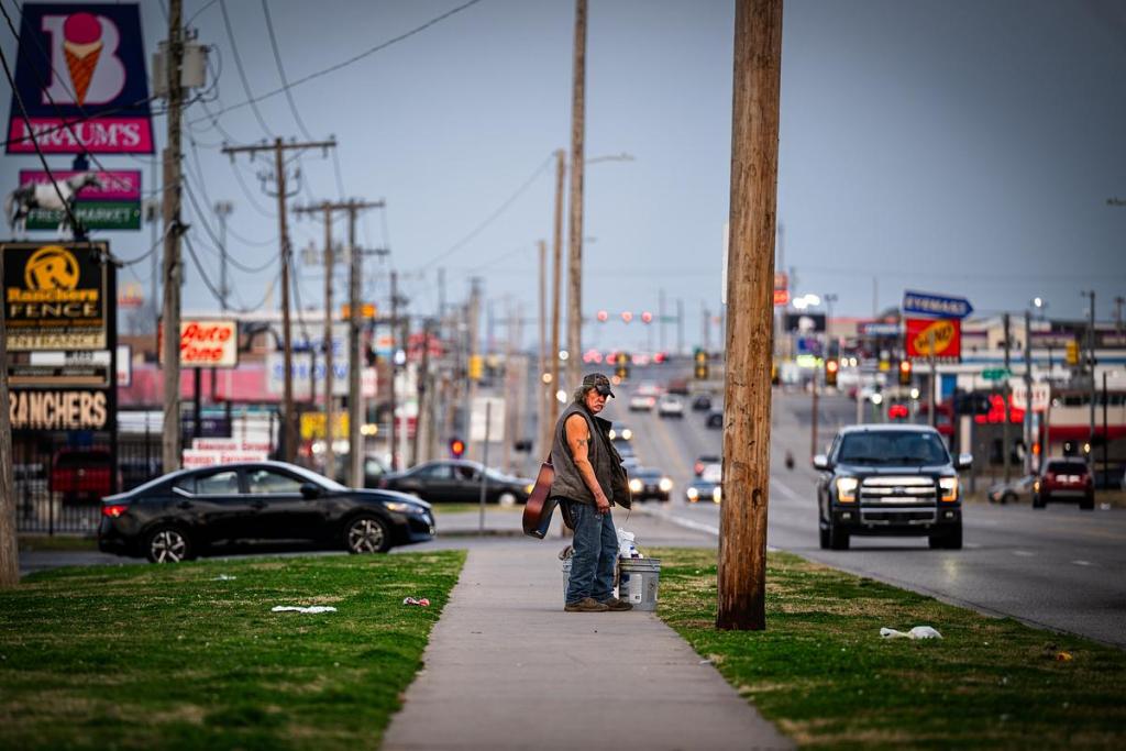 A man stands on the street on East Admiral Place March 5, 2026.