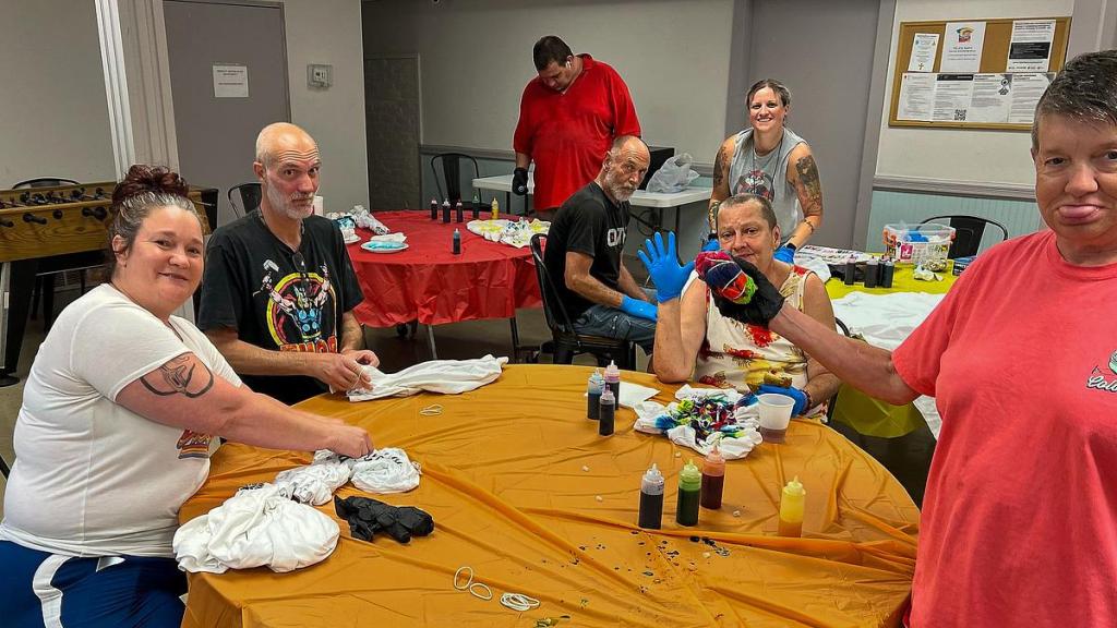 Participants in Mental Health Association Oklahoma's Creating Connections program work together to tie-dye T-shirts. The support program for people living with severe mental illness has been eliminated as a result of Oklahoma Department of Mental Health and Substance Abuse Services contract cuts. 