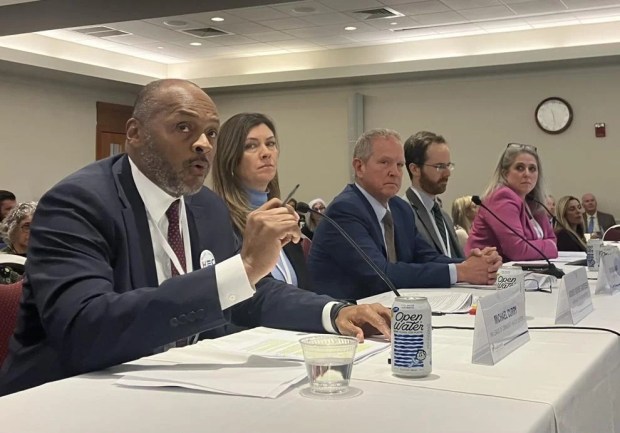 Massachusetts League of Community Health Centers CEO Michael Curry, Massachusetts Health Connector Executive Director Audrey Morse Gasteier, Cape Cod Healthcare CEO Michael Lauf, Undersecretary for MassHealth Mike Levine and Health Care For All Executive Director Amy Rosenthal testify at the Health Policy Commission's annual cost trends Wednesday at Suffolk University Law School. (Alison Kuznitz/SHNS)