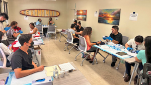 people sitting in a room for health testing