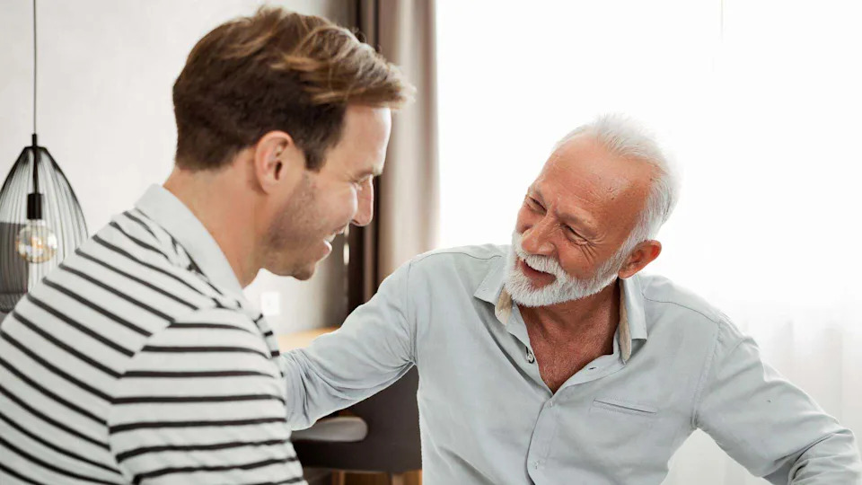 Man and son talking.