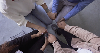 Link to Video: A group of people holding hands