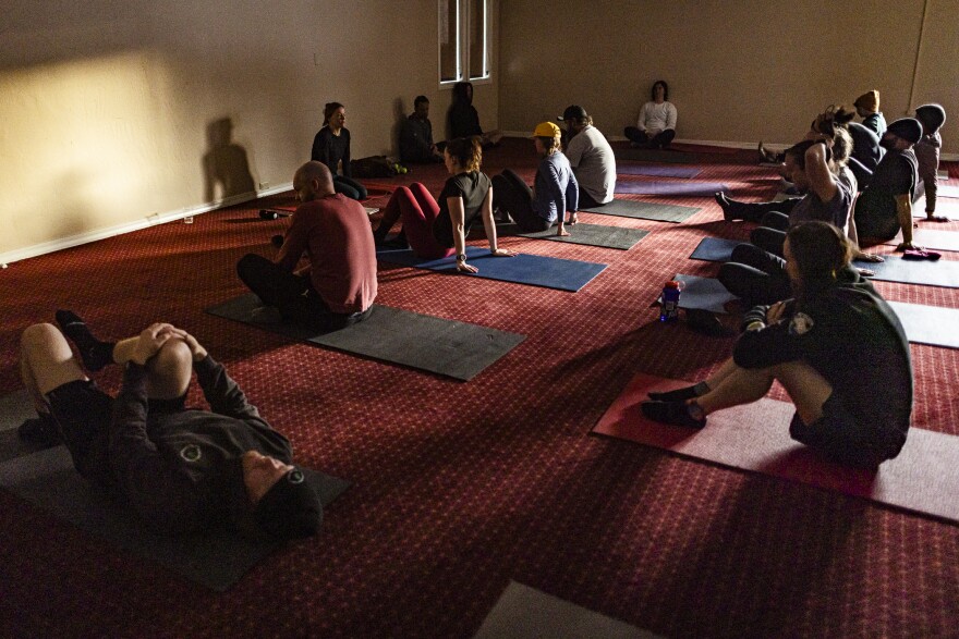 Alaina Wilson with Higher Ground leads the group in a series of movement exercises and guided meditation 