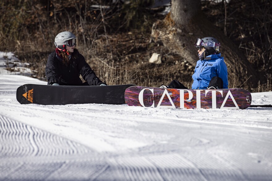 Higher Ground’s Alaina Wilson shares some snowboarding pointers with Stella Vincent. 