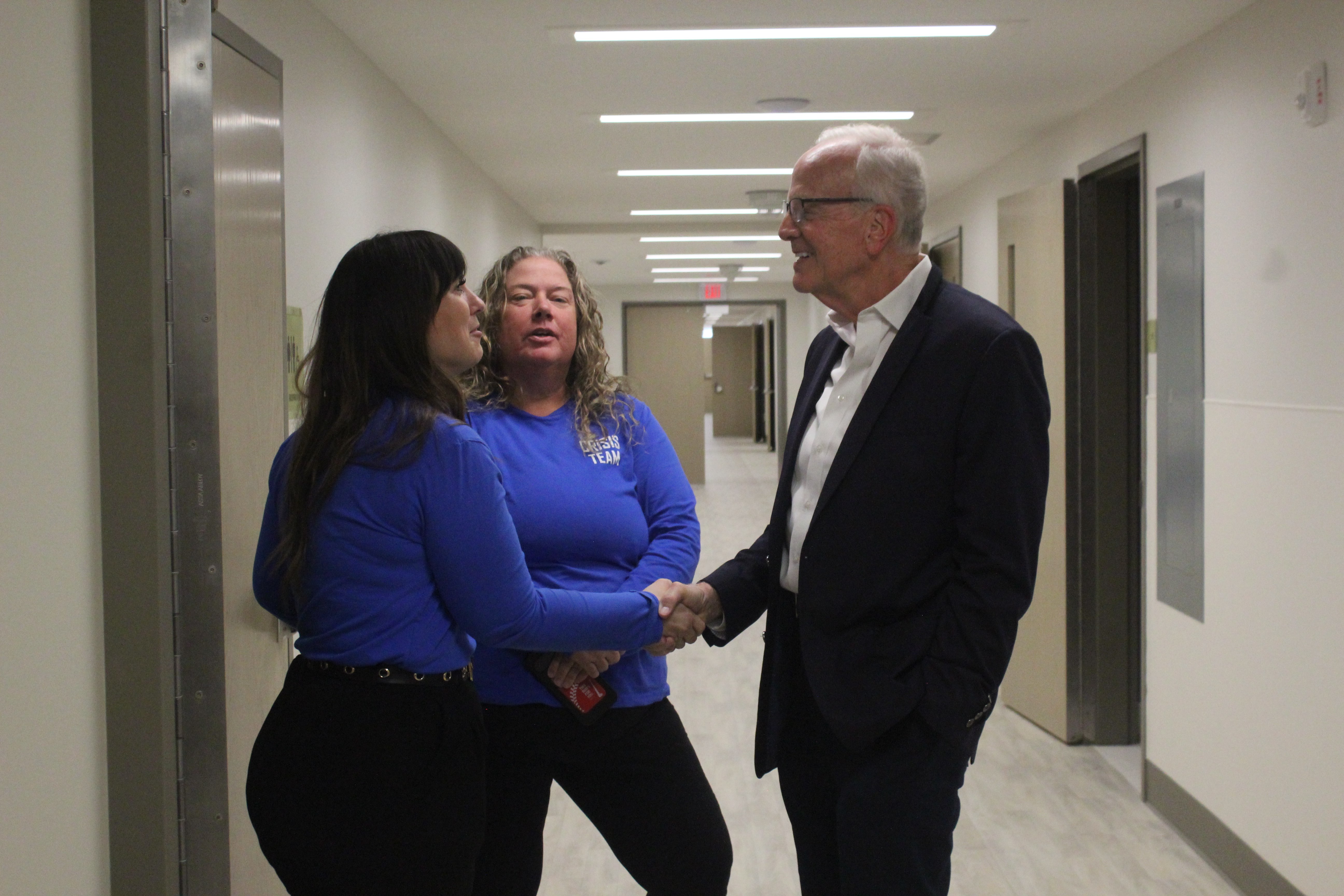 Members of the High Plains Mental Health Crisis Team greet Sen. Jerry Moran, R-Kansas, during a tour of the Crisis Intervention Center on Thursday in Hays. Photo by Cristina Janney/ Hays Post